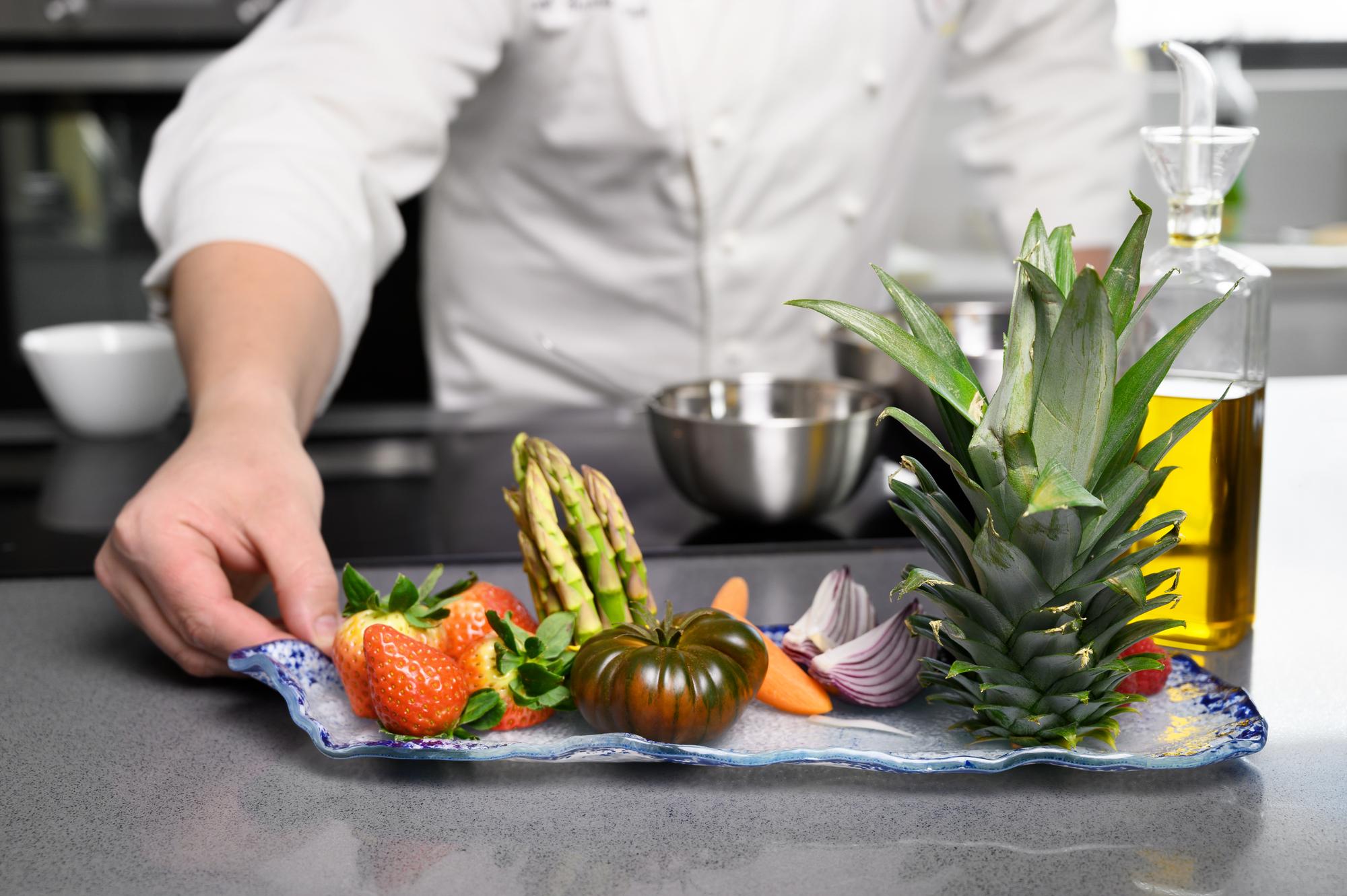 chef preparing a meal in bright kitchen